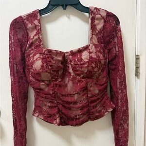 Madden Girl Burgundy Lace Long Sleeve Top.Its fit on Medium tag was XL.